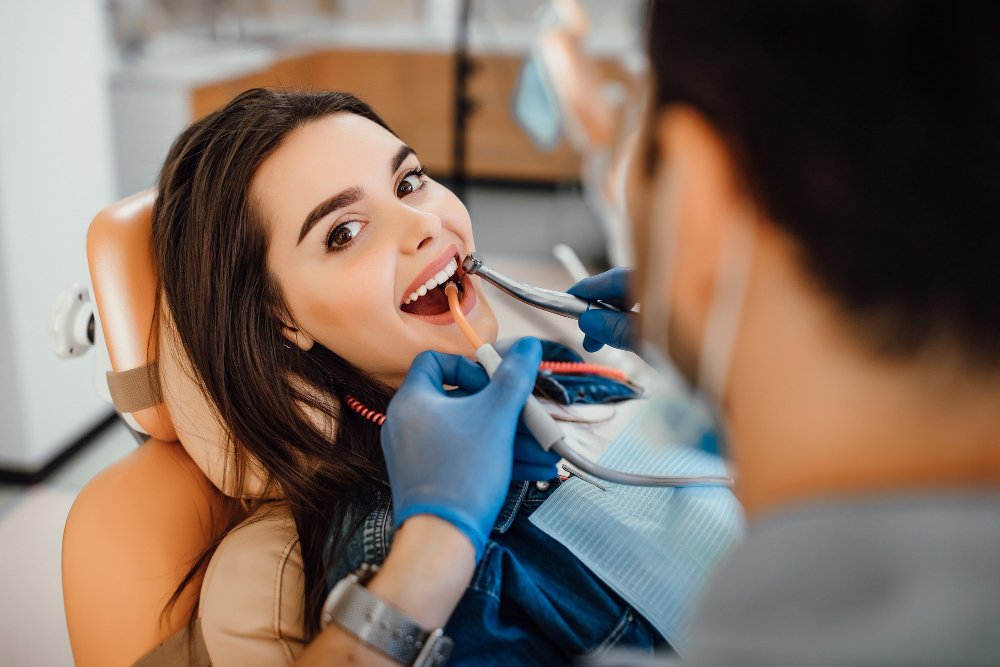 Dentist checking a patient in the dental chair